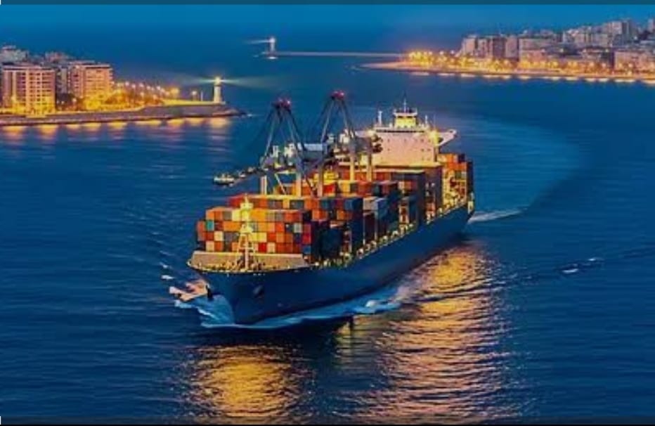 Container ship at a port at night